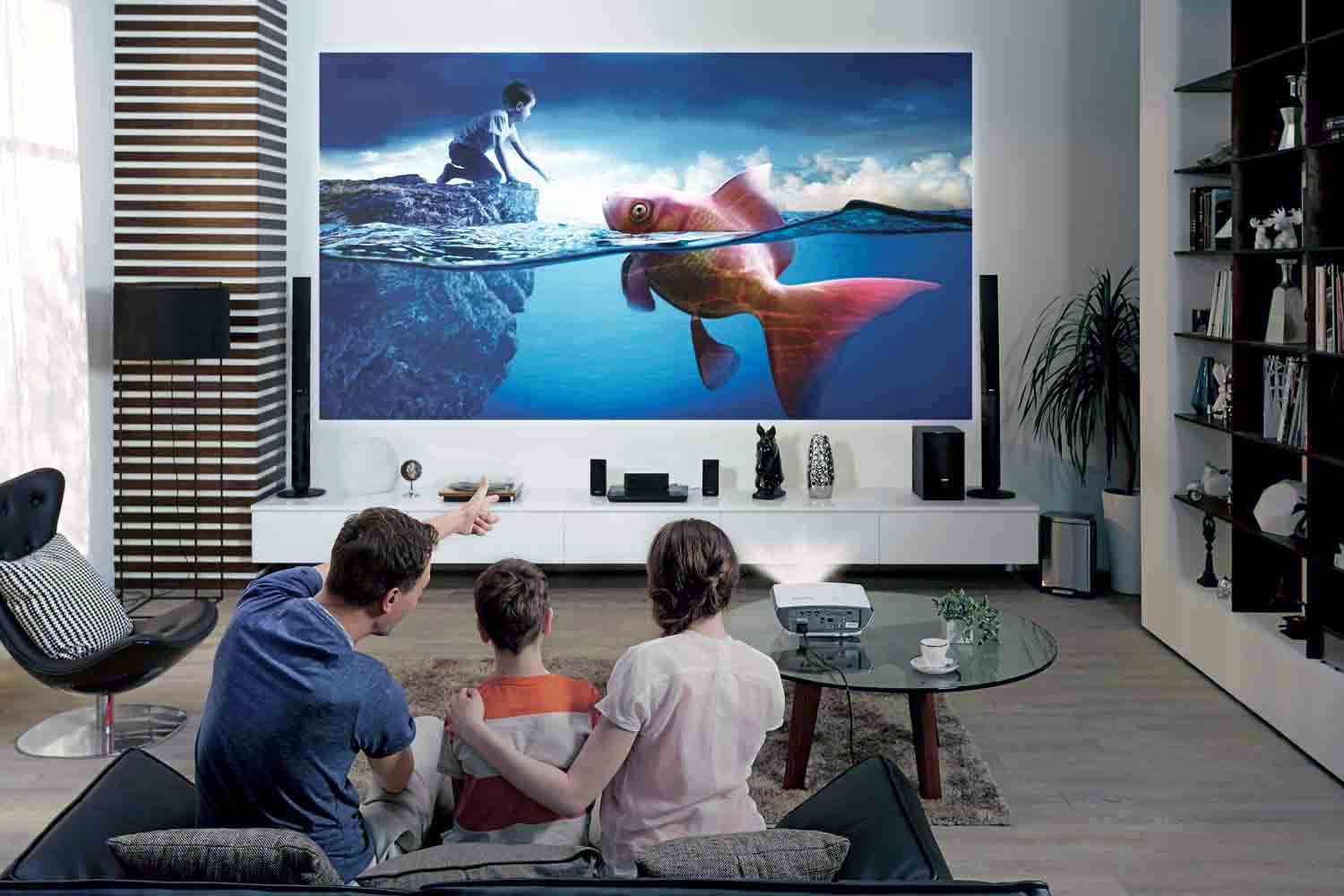 father showing his younger son and older daughters a smart tv